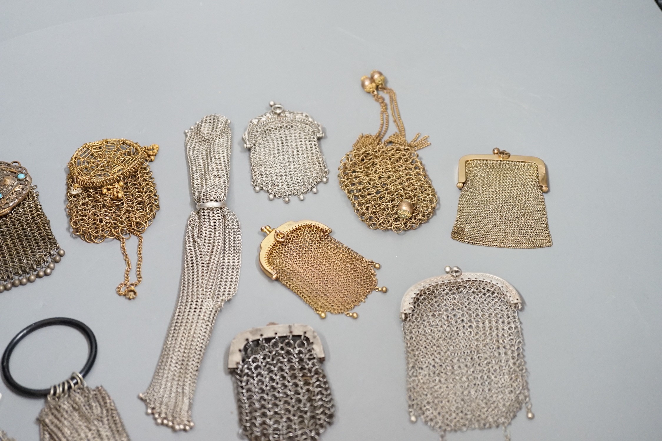 A collection of 19th century multi coloured metal chain mail evening bags and purses (14)